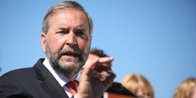 TORONTO, ON - JULY 20: With a backdrop of NDP MP's, NDP Leader Thomas Mulcair speaks during an Ontario tour launch at the Hugh Garner Co-op. (Cole Burston/Toronto Star via Getty Images)