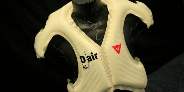 Italian safety equipment manufacturer Dainese presents the 'D Air SKI airbag' protection vest during a press conference in Kitzbuehel, Austria on January 23, 2014. Alpine skiing's governing body, the FIS, is hoping to introduce the airbags in a bid to increase safety in a sport that enjoys its fair share of high-speed crashes. But racers will not be kitted out with airbags for next month's Sochi Olympics as testing continues into the latest prototype presented by Italian company Dainese. AFP PHOTO / ALEXANDER KLEIN (Photo credit should read ALEXANDER KLEIN/AFP/Getty Images)