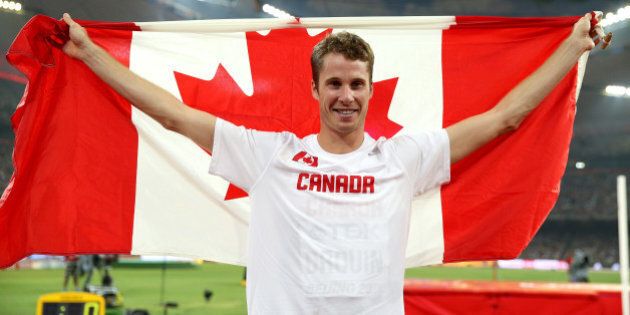 BEIJING, CHINA - AUGUST 30: Derek Drouin of Canada celebrates after winning gold in the Men's High Jump Final during day nine of the 15th IAAF World Athletics Championships Beijing 2015 at Beijing National Stadium on August 30, 2015 in Beijing, China. (Photo by Ian Walton/Getty Images)
