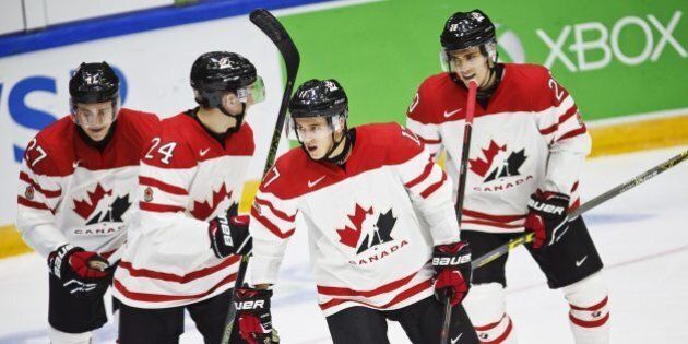 From left: Canada's Mitchell Stephens, Travis Dermott, Travis Konecny and Roland McKeown celebrate the 4-1 goal during the 2016 IIHF World Junior Ice Hockey Championship match between Canada and Denmark in Helsinki, Finland, Monday, Dec. 28, 2015. (Roni Rekomaa/Lehtikuva via AP) FINLAND OUT