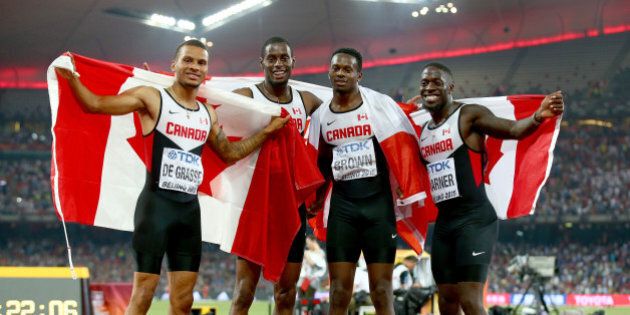 BEIJING, CHINA - AUGUST 29: Aaron Brown of Canada, Andre De Grasse of Canada, Brendon Rodney of Canada and Justyn Warner of Canada celebrate after winning bronze in the Men's 4x100 Metres Relay final during day eight of the 15th IAAF World Athletics Championships Beijing 2015 at Beijing National Stadium on August 29, 2015 in Beijing, China. (Photo by Ian Walton/Getty Images)