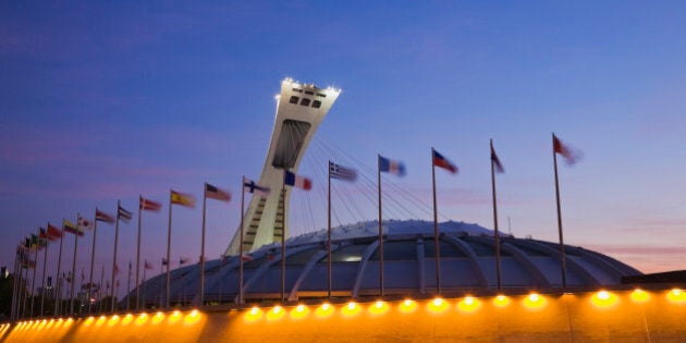 Olympic Stadium, designed by Architect Roger Taillibert, illuminated at dawn, Montreal, PQ, Canada