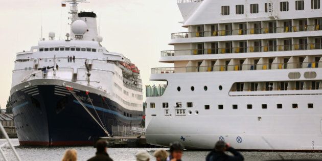Cruise liners 'Marco Polo' (L) and 'AIDAblu' lay at the port of Warnemuende near Rostock, northeastern Germany, on September 26, 2012. The Baltic Sea port posted a record in the year 2012, with 40 cruiseships calling the port 181 times. AFP PHOTO / BERND WUESTNECK GERMANY OUT (Photo credit should read BERND WUESTNECK/AFP/GettyImages)