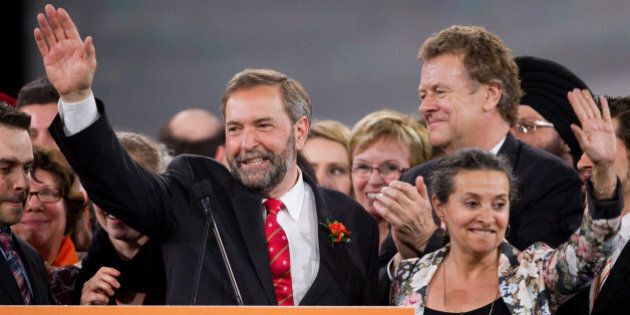 Thomas Mulcair and his wife Catherine Pinhas wave to the crowd after winning the leadership in four ballots over Brian Topp during the New Democratic Party leadership convention in Toronto, Ontario, March 24, 2012. Canada's social democrats Saturday chose a firebrand center-leaning MP to run for prime minister in 2015, after the death of a leader who led them to into the opposition benches in a historic ballot last year. Former deputy leader Thomas Mulcair won the New Democratic Party nomination with 33,881 votes, beating out six rivals by vowing to track the NDP to the center to appeal to a broader electorate and consolidate its recent gains. AFP PHOTO / Geoff Robins (Photo credit should read GEOFF ROBINS/AFP/Getty Images)