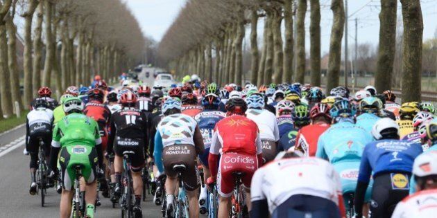 The pack of cyclists compete on March 27, 2016 during the 78th edition of the Gent-Wevelgem one day cycling race, 242,8 km from Deinze to Wevelgem. / AFP / Belga / DIRK WAEM / Belgium OUT (Photo credit should read DIRK WAEM/AFP/Getty Images)