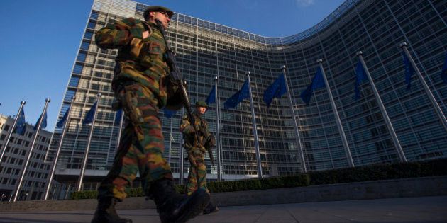 Belgian soldiers patrol outside the European Commission headquarters in central Brussels January 17, 2015. Belgium is deploying hundreds of troops to guard potential targets of terrorism, including Jewish sites and diplomatic missions, following a series of raids and arrests, the defence minister said on Saturday.Up to 300 military will be stationed at locations such as the U.S. and Israeli embassies in Brussels and NATO and EU institutions. REUTERS/Yves Herman (BELGIUM - Tags: CRIME LAW MILITARY)