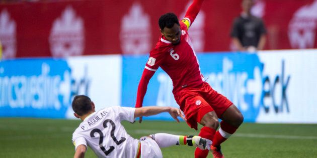 VANCOUVER, BC - MARCH 25: Paul Aguilar #22 of Mexico takes the ball away from Julian de Guzman #6 of Canada during FIFA 2018 World Cup Qualifier soccer action at BC Place on March 25, 2016 in Vancouver, Canada. (Photo by Rich Lam/Getty Images)