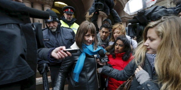 Actress Lucy DeCoutere, a complainant in the case against former Canadian radio host Jian Ghomeshi, leaves the court after an Ontario judge found him not guilty on four sexual assault charges and one count of choking, in Toronto, March 24, 2016. REUTERS/Mark Blinch