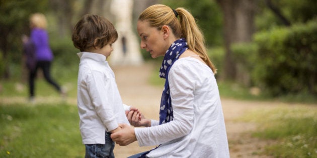 Portrait of a mother talking to her son