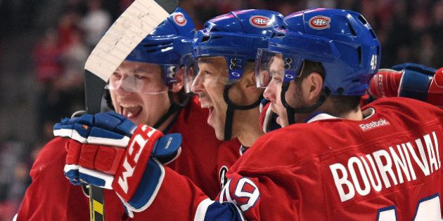 MONTREAL, QC - FEBRUARY 28: Manny Malhotra #20 of the Montreal Canadiens celebrates with teammates after scoring a goal against the Toronto Maple Leafs in the NHL game at the Bell Centre on February 28, 2015 in Montreal, Quebec, Canada. (Photo by Francois Lacasse/NHLI via Getty Images)