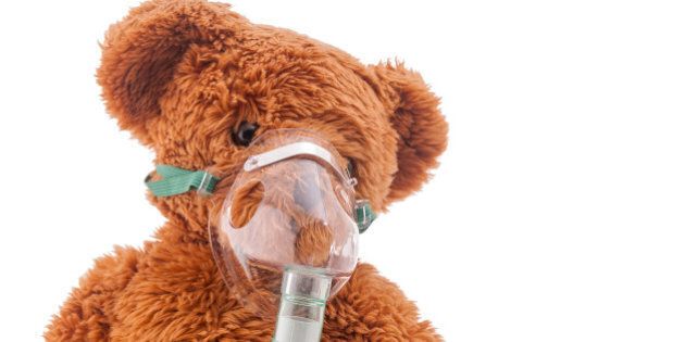 Teddy bear taking asthma treatment.
