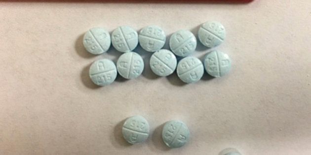 This undated photo provided by the Tennessee Bureau of Investigation shows fake Oxycodone pills that are actually fentanyl that were seized and submitted to bureau crime labs. Street fentanyl is increasingly dangerous to users, with thousands of deaths in recent years blamed on the man-made opiate. But police say officers are at risk, too, because the drug can be inhaled if powder becomes airborne, or it can be absorbed through the skin. Fentanyl is sometimes placed in tablets of counterfeit prescription drugs, but also comes in the form of patches, powder and even sprays. (Tommy Farmer/Tennessee Bureau of Investigation via AP)