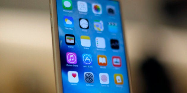 A new Apple iPhone 6S is displayed at an Apple store on Chicago's Magnificent Mile, Friday, Sept. 25, 2015, in Chicago. (AP Photo/Kiichiro Sato)