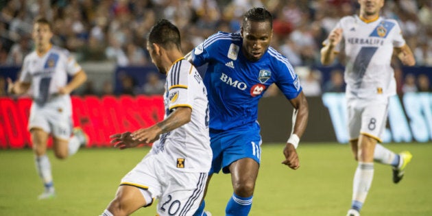 CARSON, CA - SEPTEMBER 12: Didier Drogba #11 of Montreal Impact battles A.J. DeLaGarza #20 of Los Angeles Galaxy during Los Angeles Galaxy's MLS match against Montreal Impact at the StubHub Center on September 12, 2015 in Carson, California. The match ended in 0-0 tie (Photo by Shaun Clark/Getty Images)