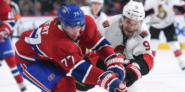 MONTREAL, QC - NOVEMBER 3: Tom Gilbert #77 of the Montreal Canadiens and Milan Michalek #9 of the Ottawa Senators battle for the puck in the NHL game at the Bell Centre on November 3, 2015 in Montreal, Quebec, Canada. (Photo by Francois Lacasse/NHLI via Getty Images)