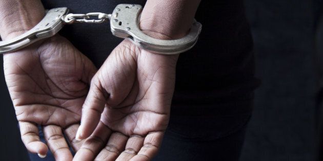 Black woman in handcuffs
