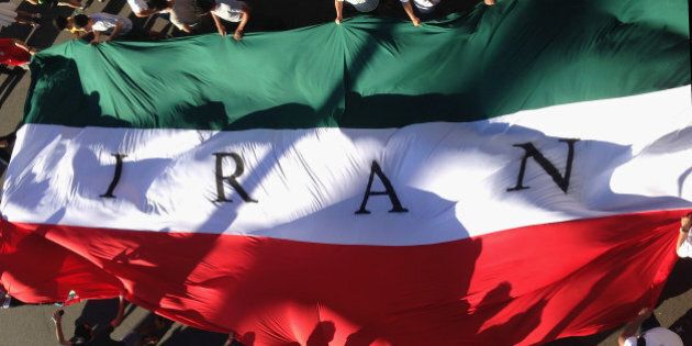 MELBOURNE, AUSTRALIA - JANUARY 11: IR Iran fans hold up a giant flag during the 2015 Asian Cup match between IR Iran and Bahrain at AAMI Park on January 11, 2015 in Melbourne, Australia. (Photo by Quinn Rooney/Getty Images)