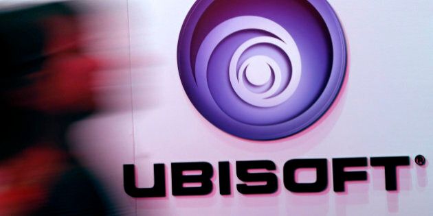 A man walks past a Ubisoft logo at the 2014 Electronic Entertainment Expo, known as E3, in Los Angeles, California June 11, 2014. REUTERS/Jonathan Alcorn (UNITED STATES - Tags: SCIENCE TECHNOLOGY BUSINESS LOGO SOCIETY)