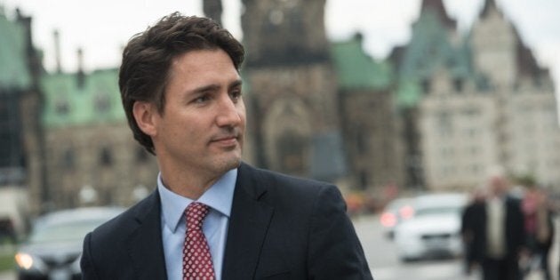 Canadian Liberal Party leader Justin Trudeau walks from the parliament to give a press conference in Ottawa on October 20, 2015 after winning the general elections. AFP PHOTO/NICHOLAS KAMM (Photo credit should read NICHOLAS KAMM/AFP/Getty Images)