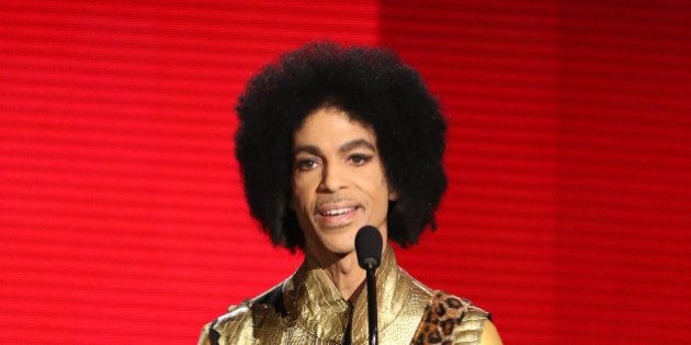 Prince presents the award for favorite album - soul/R&B at the American Music Awards at the Microsoft Theater on Sunday, Nov. 22, 2015, in Los Angeles. (Photo by Matt Sayles/Invision/AP)