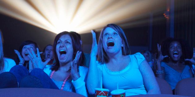 Audience Screaming in Movie Theater