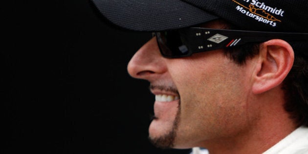 INDIANAPOLIS, IN - MAY 27: Pole sitter Alex Tagliani, driver of the #77 Bowers & Wilkins/ Sam Schmidt Motorsports Dallara Honda, looks on during final practice on Carb Day for the the 95th Indianapolis 500 Mile Race at the Indianapolis Motor Speedway on May 27, 2011 in Indianapolis, Indiana. (Photo by Jonathan Ferrey/Getty Images)