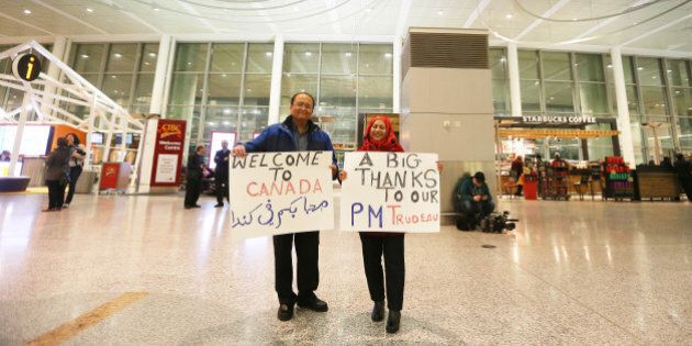 MISSISSAUGA, ON- DECEMBER 10: Zohair and Aezaz Khan came up to the airport to show support for the refugees and for the government. Syrian refugees begin to arrive in Canada at Pearson International Airport in Mississauga. December 10, 2015. (Steve Russell/Toronto Star via Getty Images)