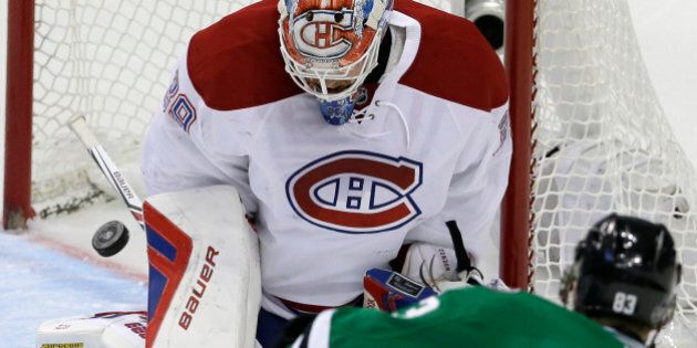 Montreal Canadiens goalie Mike Condon (39) blocks a shot against Dallas Stars right wing Ales Hemsky (83) during the second period of an NHL hockey game Saturday, Dec. 19, 2015, in Dallas. (AP Photo/LM Otero)