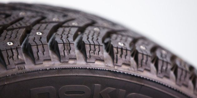 A logo sits on the sidewall of a finished studded winter tyre inside the Vsevolozhsk tyre manufacturing plant, operated by Nokian Renkaat Oyj in Vsevolozhsk, near St. Petersburg, on Tuesday, Nov. 17, 2015. Nokian Renkaat Oyj, the biggest tyre producer in the Nordic region, exports tyres to more than 40 countries making Nokian Tyres the largest exporter of consumer goods in Russia. Photographer: Andrey Rudakov/Bloomberg via Getty Images