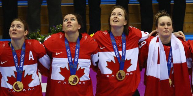 SOCHI, RUSSIA - FEBRUARY 20: (L-R) Gold medalists Hayley Wickenheiser #22, Natalie Spooner #24, Tara Watchorn #27 and Marie-Philip Poulin #29 of Canada celebrate during the flower ceremony for the Ice Hockey Women's Gold Medal Game on day 13 of the Sochi 2014 Winter Olympics at Bolshoy Ice Dome on February 20, 2014 in Sochi, Russia. (Photo by Doug Pensinger/Getty Images)