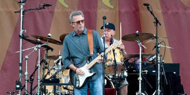 NEW ORLEANS, LA - APRIL 27: Eric Clapton performs during the 2014 New Orleans Jazz & Heritage Festival at Fair Grounds Race Course on April 27, 2014 in New Orleans, Louisiana. (Photo by Erika Goldring/WireImage)