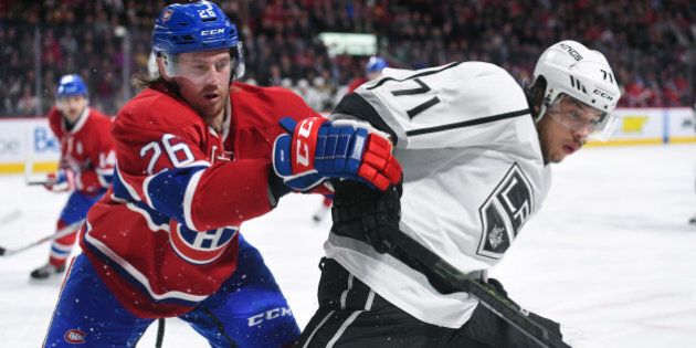 MONTREAL, QC - DECEMBER 17: Jeff Petry #26 of the Montreal Canadiens and Jordan Nolan #71 of the Los Angeles Kings battle for the puck in the NHL game at the Bell Centre on December 17, 2015 in Montreal, Quebec, Canada. (Photo by Francois Lacasse/NHLI via Getty Images)