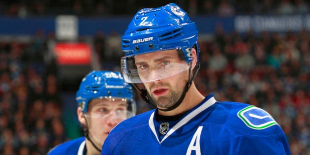 VANCOUVER, BC - NOVEMBER 22: Dan Hamhuis #2 of the Vancouver Canucks looks on from the bench during their NHL game against the New Jersey Devils at Rogers Arena November 22, 2015 in Vancouver, British Columbia, Canada. (Photo by Jeff Vinnick/NHLI via Getty Images)