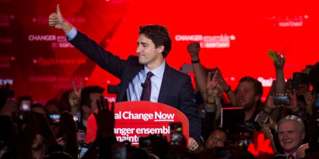 Justin Trudeau, Canada's prime minister-elect and leader of the Liberal Party of Canada, gestures to supporters on election night in Montreal, Quebec, Canada, on Tuesday, Oct. 20, 2015. Trudeau's Liberal Party swept into office with a surprise majority, ousting Prime Minister Stephen Harper and capping the biggest comeback election victory in Canadian history. Photographer: Kevin Van Paassen/Bloomerg