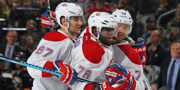 BUFFALO, NY - OCTOBER 23: Andrei Markov #79 of the Montreal Canadiens celebrates his second period goal against the Buffalo Sabres with teammates Max Pacioretty #67 and P.K. Subban #76 during an NHL game on October 23, 2015 at the First Niagara Center in Buffalo, New York. (Photo by Bill Wippert/NHLI via Getty Images)