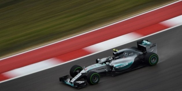 Mercedes AMG Petronas driver Nico Rosberg of Germany corners in a wet track during the first practice session of the United States Formula One Grand Prix at the Circuit of The Americas in Austin, Texas on October 23, 2015. AFP PHOTO / MARK RALSTON (Photo credit should read MARK RALSTON/AFP/Getty Images)