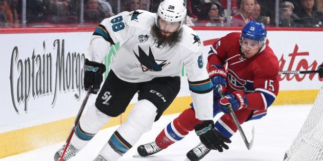MONTREAL, QC - DECEMBER 15: Brent Burns #88 of the San Jose Sharks controls the puck against Tomas Fleischmann #15 of the Montreal Canadiens in the NHL game at the Bell Centre on December 15, 2015 in Montreal, Quebec, Canada. (Photo by Francois Lacasse/NHLI via Getty Images)