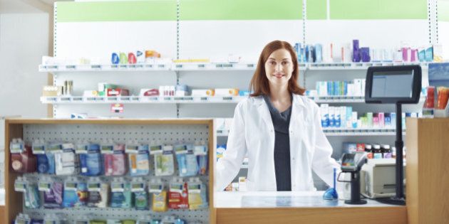 Female pharmacist at a counter in pharmacy