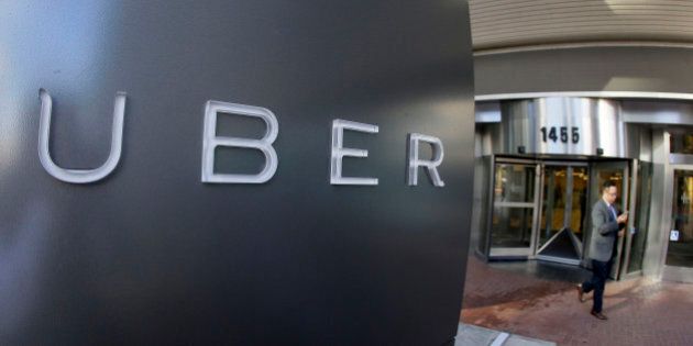 FILE - In this Dec. 16, 2015, file photo, a man leaves the headquarters of Uber in San Francisco. The killings in Kalamazoo, Michigan, raised anew a question that has dogged Uber and other taxi competitors. Their rides may be cheaper and more conveniently hailed than a cab, but the question is are they as safe. (AP Photo/Eric Risberg, File)