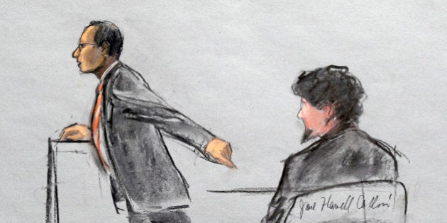 In this courtroom sketch, Assistant U.S. Attorney Aloke Chakravarty is depicted pointing to defendant Dzhokhar Tsarnaev, right, during closing arguments in Tsarnaev's federal death penalty trial Monday, April 6, 2015, in Boston. Tsarnaev is charged with conspiring with his brother to place two bombs near the Boston Marathon finish line in April 2013, killing three and injuring 260 people. (AP Photo/Jane Flavell Collins)