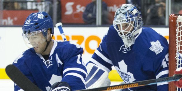 TORONTO, ON - OCTOBER 3: StÃ©phane Robidas helps out Jonathan Bernier in the second period. The Toronto Maple Leafs hosted the Detroit Red Wings Friday night and won 5-1. (Lucas Oleniuk/Toronto Star via Getty Images)