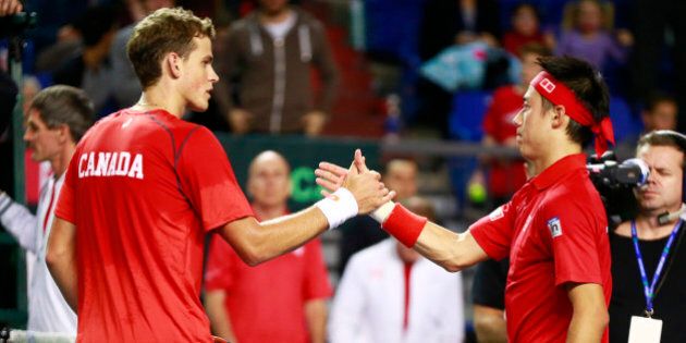 VANCOUVER, CANADA - MARCH 6: Vasek Pospisil of Canada congratulates Kei Nishikori of Japan after their Davis Cup match March 6, 2015 in Vancouver, British Columbia, Canada. Nishikori defeated Pospisil 3-0. (Photo by Jeff Vinnick/Getty Images)