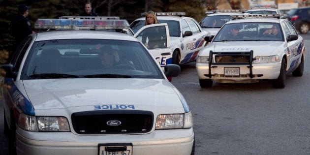 Prop cruisers from the TV show "Rookie Blue", together with a real escort ready for aerial chase shots at Lakeshore and Leslie, Toronto, Ontario.