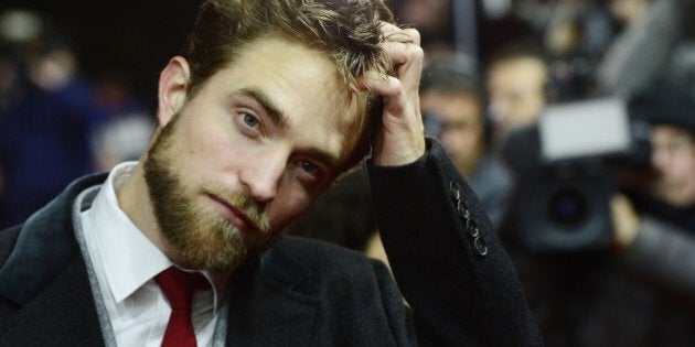 British actor Robert Pattinson poses for photographers upon arrival for the screening of the film 'Life' presented as Berlinale Special at the 65th Berlin International Film Festival Berlinale in Berlin, on February 9, 2015. AFP PHOTO / JOHN MACDOUGALL (Photo credit should read JOHN MACDOUGALL/AFP/Getty Images)