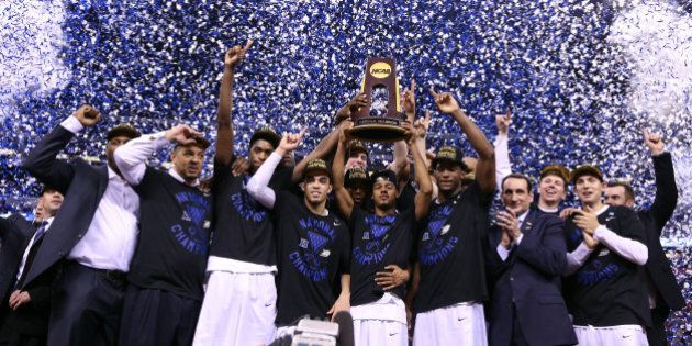 INDIANAPOLIS, IN - APRIL 06: The Duke Blue Devils celebrate with the championship trophy after defeating the Wisconsin Badgers during the NCAA Men's Final Four National Championship at Lucas Oil Stadium on April 6, 2015 in Indianapolis, Indiana. Duke defeated Wisconsin 68-63. (Photo by Streeter Lecka/Getty Images)