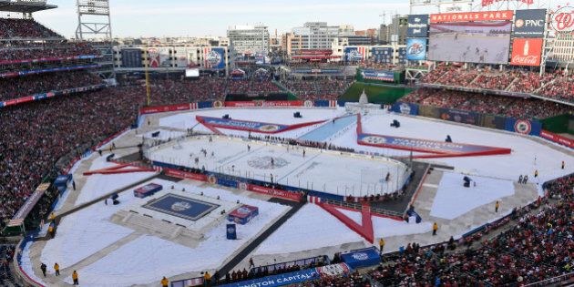 The Chicago Blackhawks play the Washington Capitals in the third period of the Winter Classic outdoor NHL hockey game at Nationals Park in Washington, Thursday, Jan. 1, 2015. The Capitals won 3-2. (AP Photo/Susan Walsh)