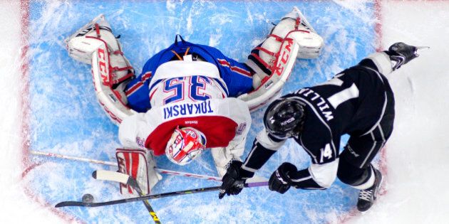 Los Angeles Kings right wing Justin Williams, right, tries to get a shot in on Montreal Canadiens goalie Dustin Tokarski during the first period of an NHL hockey game, Thursday, March 5, 2015, in Los Angeles. (AP Photo/Mark J. Terrill)