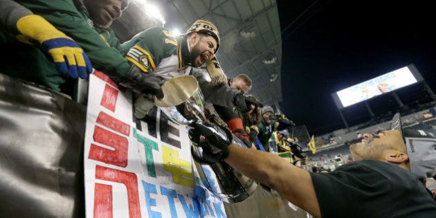 WINNIPEG, CANADA - NOVEMBER 29: Eddie Steele #97 of the Edmonton Eskimos holds the Grey Cup after the team defeated the Ottawa Redblacks at Investors Group Field during Grey Cup 103 on November 29, 2015 in Winnipeg, Manitoba, Canada. (Photo by Trevor Hagan/Getty Images)