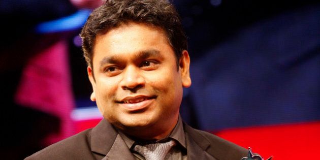 Indian artist AR Rahman smiles as he receives the award for Outstanding Achievement inn Music at The Asian Awards at Grosvenor House Hotel, Park Lane, London, on Tuesday, Oct. 26, 2010. (AP Photo/Paul Jeffers)
