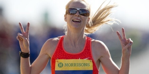 Britain's Gemma Steel celebrates coming second in the women's elite race in the Great North Run half-marathon in South Shields, north east England on September 13, 2015. The Great North Run is Britain's largest running event with more than 50,000 participants set to cover the 13.1 miles from Newcastle to South Shields. AFP PHOTO / OLI SCARFF (Photo credit should read OLI SCARFF/AFP/Getty Images)